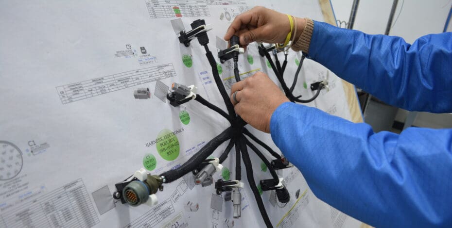 PGF Team building a wire harness assembly